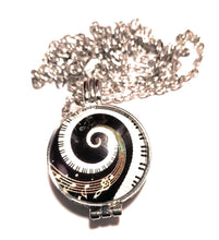 Load image into Gallery viewer, Spiral piano key essential oil diffuser locket necklace with 24-inch silver chain.