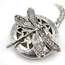 Load image into Gallery viewer, Silver dragonfly locket necklace with aromatherapy diffuser, detailed metalwork.