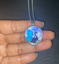 Load image into Gallery viewer, Silver chain necklace featuring a round pendant with a blue dragon design.
