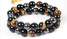 Load image into Gallery viewer, Beaded bracelet with round hematite, tiger's eye, and black obsidian stones.
